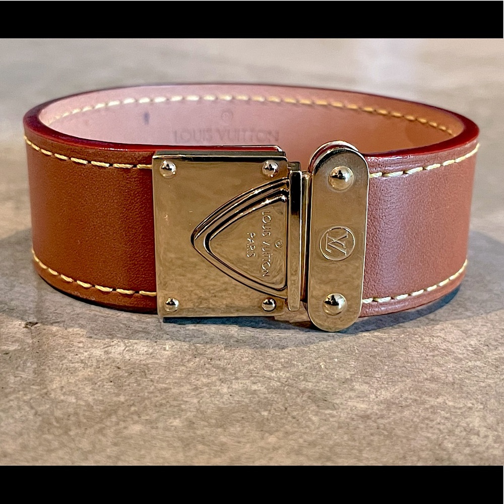Louis Vuitton Koala Suhali Leather Cuff Bracelet with gold tone hardware.